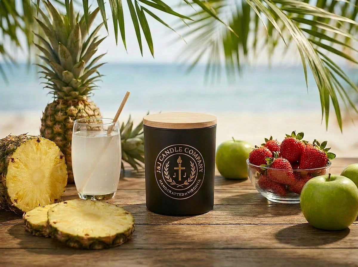 Candle with a pineapple, glass of lemonade, and strawberries on a wooden table by the sea.