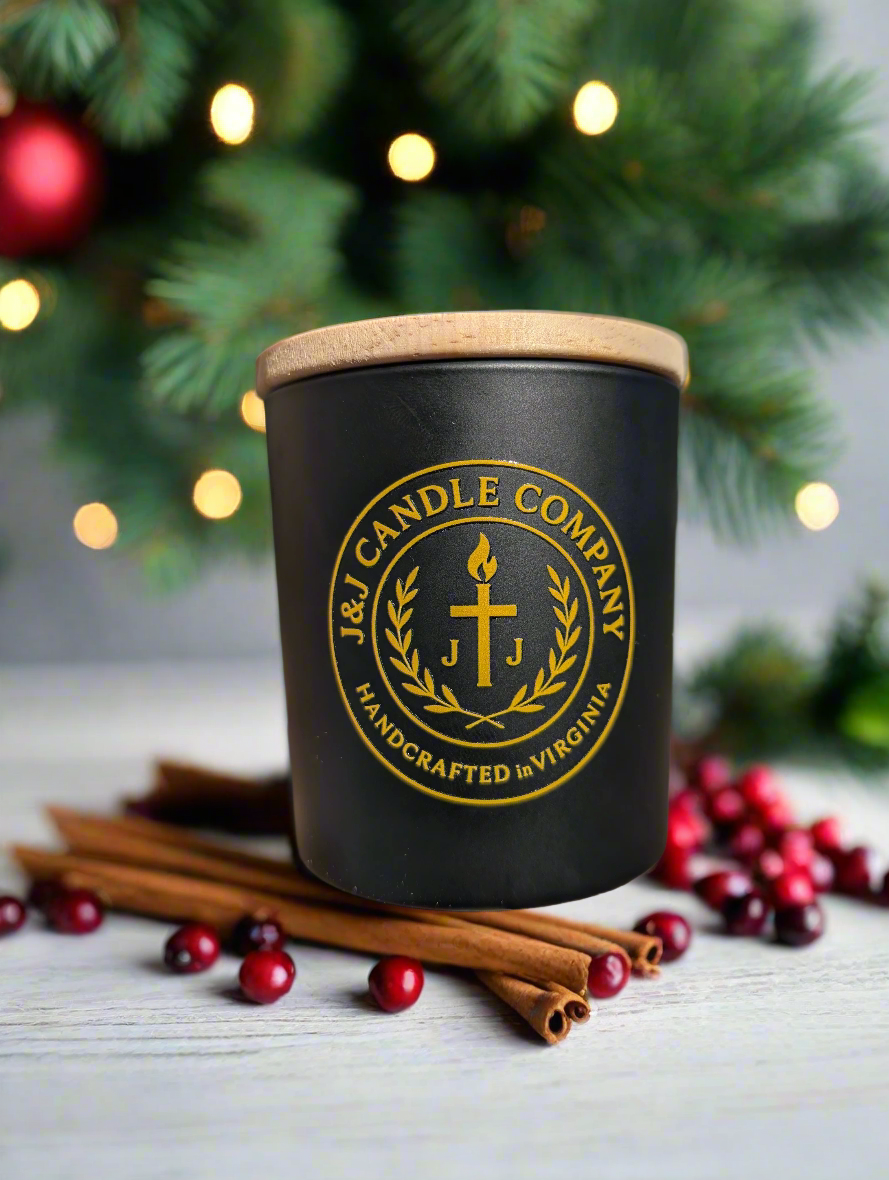 Black candle with a wooden lid featuring the J & J Candle Company Fall and Christmas Theme